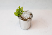Mint Julep Cocktail In Silver Glass, Against White Background, Close-up