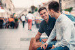 © mavoimages - Two young friends talking together on a city street