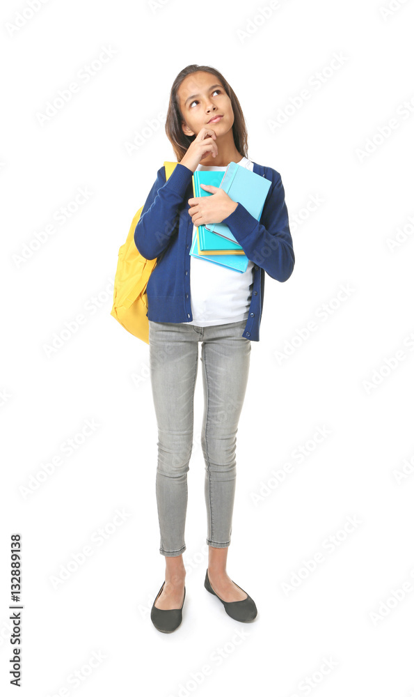 Cute schoolgirl with books on white background