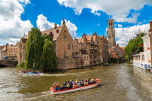 Canal In Bruges And Belfry Tower