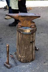 Anvil on a wooden stump top view.