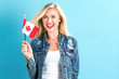 Young woman holding Canadian flag
