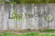 inspirational graffiti on grungy cement city wall