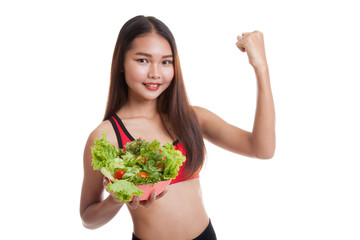 Beautiful Asian healthy girl fist up with salad.