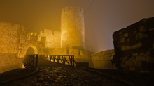 Tower And Wooden Bridge Of Kalemegdan Fortress At Foggy Night In Belgrade, Serbia