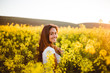 © Justin - Young girl in yellow flower field