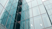 Close-up Low Angle Shot Of Modern Glass Facade Office Building In Paris