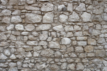 Gray stone wall textured background with space for your text or picture; Gray interior; Texture of grey stonework wall