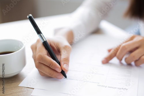 Fotografía Closeup of Applicant Completing Application Form