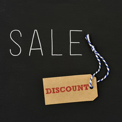 Poster - word sale and paper label with the word discount