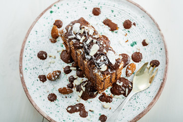 Wall Mural - Piece of chocolate Spartak cake on a table. Delicious sweet food on a beautiful plate. Top view.