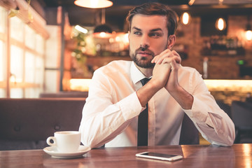 Poster - Handsome businessman in cafe