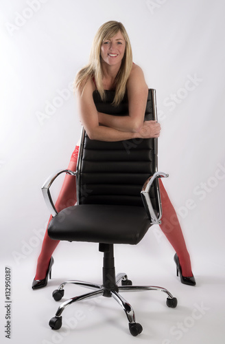 Sexy Secretary Leaning On An Office Chair Stock Photo Adobe Stock   500 F 132950387 XjiKuA0leikZYBekqRnaR059OCEOCaZZ 