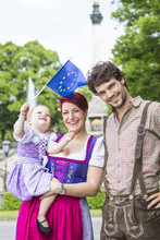 Parents And Daughter Waving European Flag