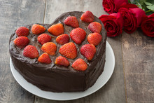 Heart Shaped Cake And Red Roses For Valentine's Day Or Mother's Day  On Wooden Background
