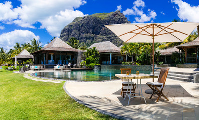 Relaxing  bar in palm shade in tropical paradise. Mauritius island