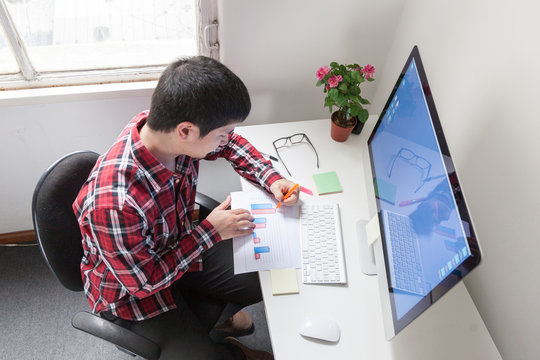Young man working at office
