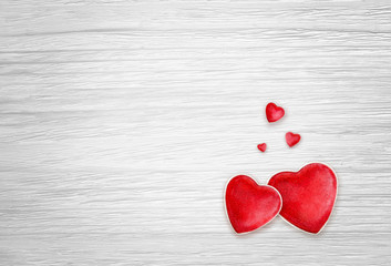 Hearts on white wood background