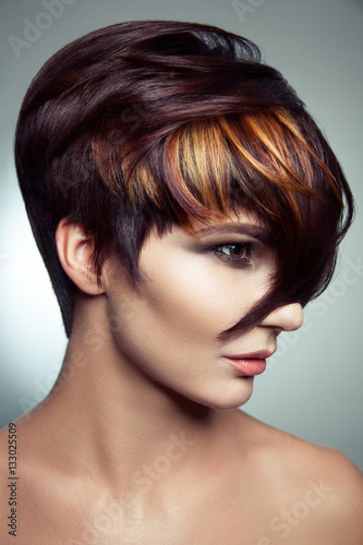 Naklejka na meble Fashion portrait of a beautiful girl with colored dyed hair, professional short hair coloring. studio shot.