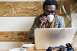 © santypan - Businessman using his laptop in the Coffee Shop.