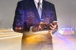 © ImagineDesign - Double exposure of business man hand hold and touch screen smart phone, mobile, urban, city and street at night as business, telecommunication and technology concept.