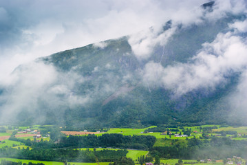 Landscape with views of the mountains in the clouds. The county of More og Romsdal. Norway