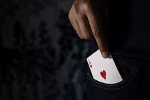 Ace Card Pulled Up From Pocket, Chance Or Risk Of Love Concept, Low-key Lighting And Selective Focus On Red Heart