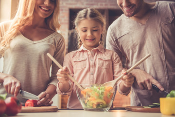 Wall Mural - Young family cooking