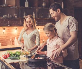 Wall Mural - Young family cooking