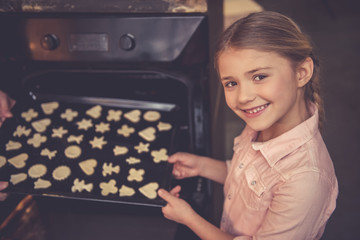 Wall Mural - Mother and daughter baking