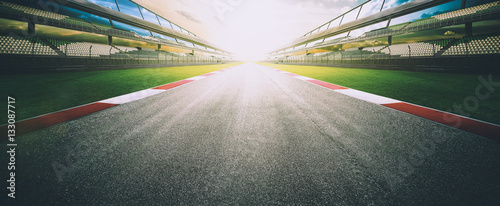 Cuadros en Lienzo View of the infinity empty asphalt international race track, digital imaging recomposition montage background