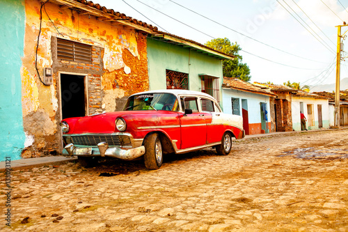Photo Red Classic Car in the colonial town of Trinidad, Cuba