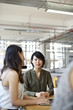 © Andy Paul - Asian businesswoman with colleagues in an office