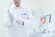 © romanets_v - proctologist doctor holding Ligador hemorroidal in office