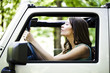 © LStockStudio - Young Woman Enjoying a Car Ride