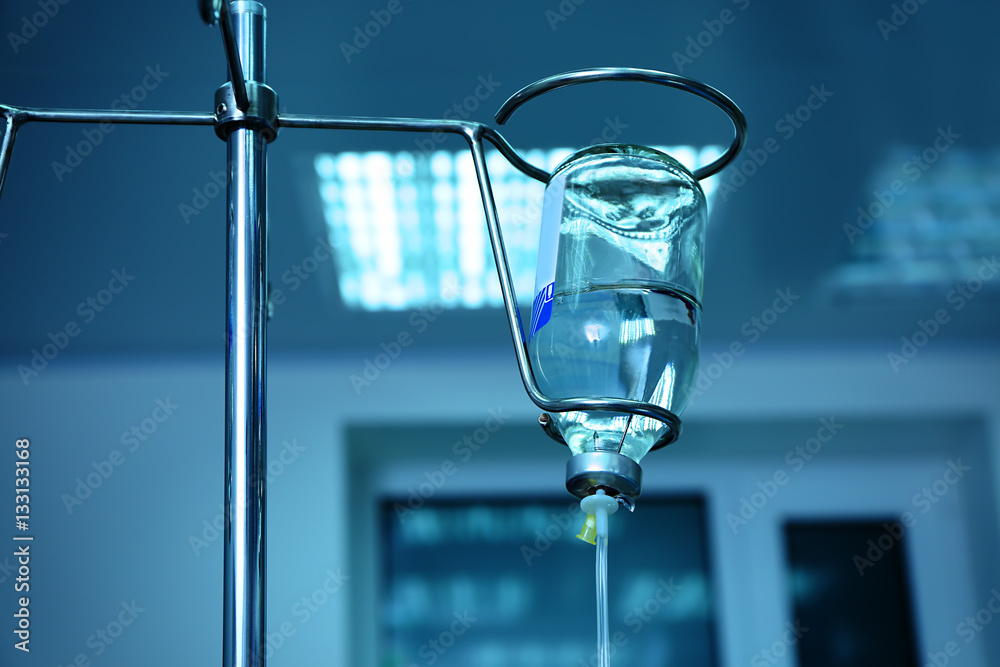 Infusion drip in hospital on blurred background