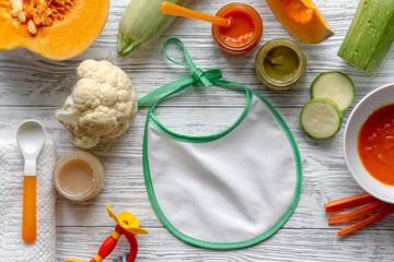 baby vegetable puree on wooden background top view