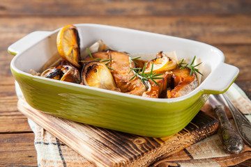 steak of red fish with  lemon and pepper in a bowl on a table, selective focus, copy space