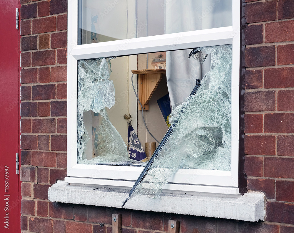 Broken window caused by burglar breaking in to premisis to steal. Stock ...