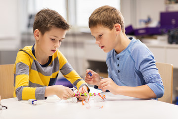 happy children building robots at robotics school