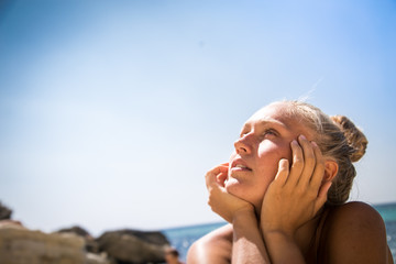 portrait of a dreaming girl staring at the sky