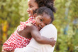 © Monkey Business - African American mother embracing with baby daughter