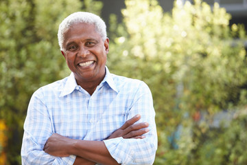 Wall Mural - Smiling senior African American man with arms crossed