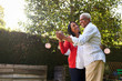 © Monkey Business - Senior black couple dancing in their back garden