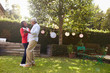 © Monkey Business - Senior black couple dance in their back garden, full length