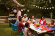 © Monkey Business - Multi generation black family having a 4th July barbecue