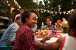 © Monkey Business - Black mother and son at family 4th July barbecue, close up