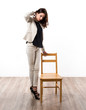 © luismolinero - Beautiful brunette girl with wooden chair