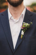 © anna_gorbenko - closeup of a bearded guy wearing white shirt and a boutonniere on his jacket