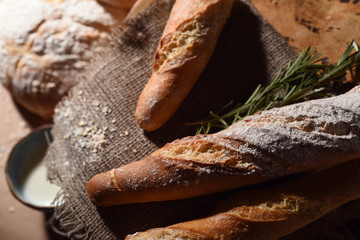 Bread and other pastries with a cup of milk